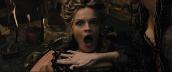 Movie still from “Into the Woods” (2014), directed by Rob Marshall – A person holding their hands over their face; Close Up shot, Overhead angle