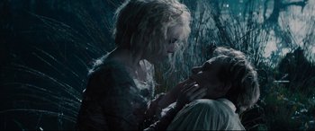 Movie still from “Into the Woods” (2014), directed by Rob Marshall – A woman and a man are touching each other's face; Close Up shot, Low angle