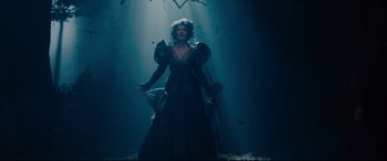 Movie still from “Into the Woods” (2014), directed by Rob Marshall – A woman standing in the middle of a dark forest; Wide shot, Overhead angle