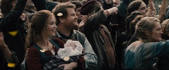 Movie still from “Into the Woods” (2014), directed by Rob Marshall – A group of people that are standing in a crowd; Medium shot, Over the shoulder angle