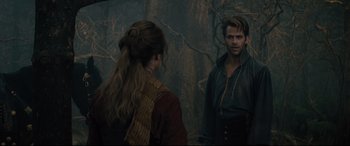 Movie still from “Into the Woods” (2014), directed by Rob Marshall – A man and a woman standing next to each other in front of a forest; Medium shot, Over the shoulder angle
