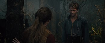 Movie still from “Into the Woods” (2014), directed by Rob Marshall – A man and a woman are standing in the woods; Medium shot, Over the shoulder angle