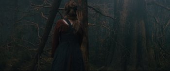 Movie still from “Into the Woods” (2014), directed by Rob Marshall – A woman standing in the middle of a forest; Medium shot, Over the shoulder angle