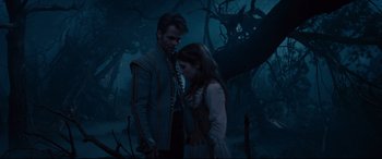 Movie still from “Into the Woods” (2014), directed by Rob Marshall – A man and a woman standing next to each other in the woods; Medium shot, Over the shoulder angle