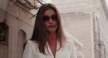 Movie still from “Intolerable Cruelty” (2003), directed by Joel Coen – A woman with long brown hair wearing sunglasses; Close Up shot, Low angle