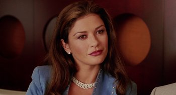 Movie still from “Intolerable Cruelty” (2003), directed by Joel Coen – A person wearing a necklace; Close Up shot, High angle