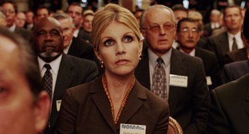 Movie still from “Intolerable Cruelty” (2003), directed by Joel Coen – A group of people sitting in front of each other; Close Up shot, Low angle