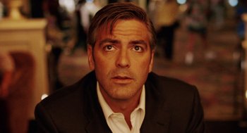 Movie still from “Intolerable Cruelty” (2003), directed by Joel Coen – A person wearing a suit and tie; Close Up shot, Low angle