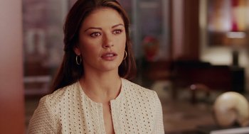 Movie still from “Intolerable Cruelty” (2003), directed by Joel Coen – A beautiful woman with long hair wearing a white jacket; Close Up shot, Over the shoulder angle