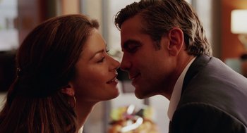 Movie still from “Intolerable Cruelty” (2003), directed by Joel Coen – A man and a woman are kissing each other; Close Up shot, Over the shoulder angle
