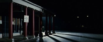 Movie still from “Invictus” (2009), directed by Clint Eastwood – A building that has some pillars in the dark; Extreme Wide shot, Low angle