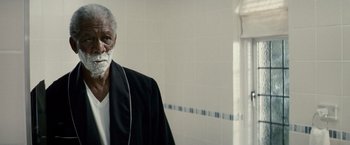 Movie still from “Invictus” (2009), directed by Clint Eastwood – An older man with a shaving cream on his face; Close Up shot, Over the shoulder angle