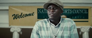 Movie still from “Invictus” (2009), directed by Clint Eastwood – A person wearing a hat; Close Up shot, Low angle