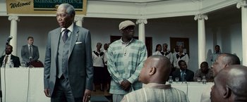 Movie still from “Invictus” (2009), directed by Clint Eastwood – A group of men standing in front of each other; Medium shot, Low angle
