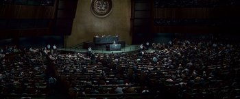 Movie still from “Invictus” (2009), directed by Clint Eastwood – A crowd of people sitting in front of a podium; Extreme Wide shot, High angle