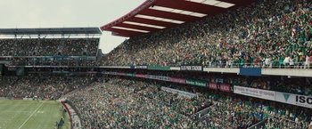 Movie still from “Invictus” (2009), directed by Clint Eastwood – A large crowd of people in a stadium; Extreme Wide shot, High angle