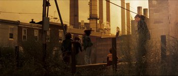 Movie still from “Invincible” (2006), directed by Ericson Core – A group of people standing on top of a wooden platform; Wide shot, Low angle