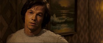 Movie still from “Invincible” (2006), directed by Ericson Core – A person with long brown hair; Close Up shot, Over the shoulder angle