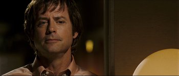 Movie still from “Invincible” (2006), directed by Ericson Core – A man's face in front of a window; Close Up shot, Over the shoulder angle