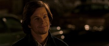 Movie still from “Invincible” (2006), directed by Ericson Core – A person wearing a jacket; Close Up shot, Over the shoulder angle