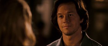 Movie still from “Invincible” (2006), directed by Ericson Core – A person wearing a white shirt; Close Up shot, Over the shoulder angle