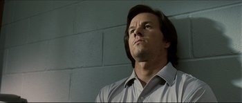 Movie still from “Invincible” (2006), directed by Ericson Core – A person wearing a dress shirt; Close Up shot, Low angle