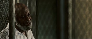 Movie still from “Invincible” (2006), directed by Ericson Core – An older man is looking at the camera; Close Up shot, Low angle