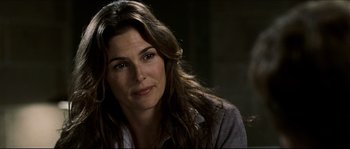 Movie still from “Invincible” (2006), directed by Ericson Core – A person with long brown hair; Close Up shot, Over the shoulder angle