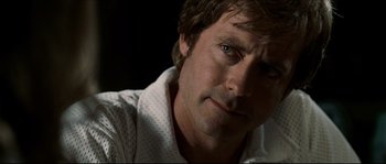 Movie still from “Invincible” (2006), directed by Ericson Core – A person wearing a white shirt; Close Up shot, Over the shoulder angle
