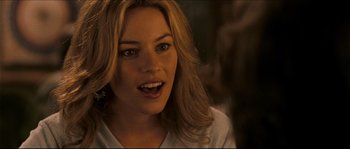 Movie still from “Invincible” (2006), directed by Ericson Core – A person with blonde hair; Close Up shot, Over the shoulder angle