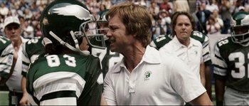 Movie still from “Invincible” (2006), directed by Ericson Core – A football player and a coach talking to each other; Close Up shot, Over the shoulder angle