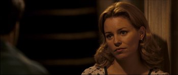 Movie still from “Invincible” (2006), directed by Ericson Core – A person wearing a floral shirt; Close Up shot, Over the shoulder angle