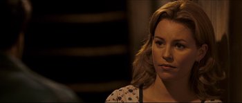 Movie still from “Invincible” (2006), directed by Ericson Core – A person wearing a floral shirt; Close Up shot, Over the shoulder angle