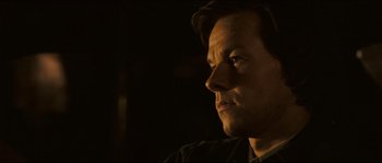 Movie still from “Invincible” (2006), directed by Ericson Core – A person looking at the camera; Close Up shot, Over the shoulder angle