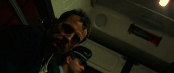 Movie still from “Irreversible” (2002), directed by Gaspar Noé – Two men are standing next to each other; Close Up shot, Low angle