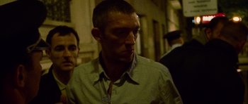 Movie still from “Irreversible” (2002), directed by Gaspar Noé – A person wearing a shirt; Close Up shot, Low angle