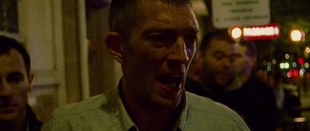 Movie still from “Irreversible” (2002), directed by Gaspar Noé – A person making a funny face; Close Up shot, Low angle