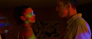 Movie still from “Irreversible” (2002), directed by Gaspar Noé – A man and a woman are looking at each other; Close Up shot, Low angle