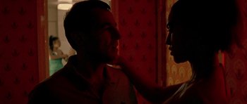 Movie still from “Irreversible” (2002), directed by Gaspar Noé – A man and a woman are touching each other's face; Close Up shot, Low angle
