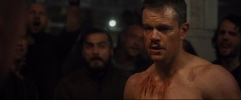 Movie still from “Jason Bourne” (2016), directed by Paul Greengrass – Matt damon with blood all over his face; Close Up shot, Over the shoulder angle