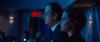 Movie still from “Jason Bourne” (2016), directed by Paul Greengrass – A man and a woman sitting next to each other; Close Up shot, Over the shoulder angle
