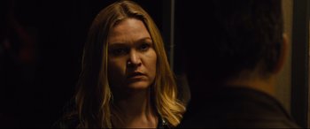 Movie still from “Jason Bourne” (2016), directed by Paul Greengrass – A person with long blonde hair; Close Up shot, Over the shoulder angle