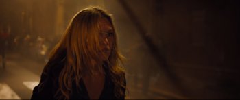 Movie still from “Jason Bourne” (2016), directed by Paul Greengrass – A woman with long blonde hair wearing glasses; Close Up shot, Over the shoulder angle