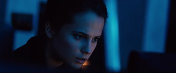 Movie still from “Jason Bourne” (2016), directed by Paul Greengrass – A person looking at the camera; Close Up shot, Low angle