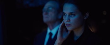 Movie still from “Jason Bourne” (2016), directed by Paul Greengrass – A man and a woman in a dark room; Close Up shot, Over the shoulder angle