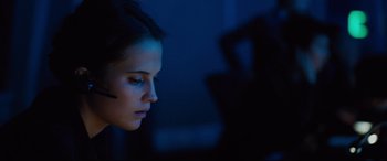 Movie still from “Jason Bourne” (2016), directed by Paul Greengrass – A woman is looking at a computer screen at night; Close Up shot, Low angle