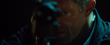 Movie still from “Jason Bourne” (2016), directed by Paul Greengrass – A man's face in the dark; Extreme Close Up shot, Low angle