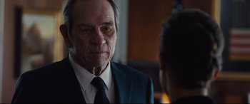 Movie still from “Jason Bourne” (2016), directed by Paul Greengrass – An older man wearing a suit and tie talking to a younger man; Close Up shot, Over the shoulder angle