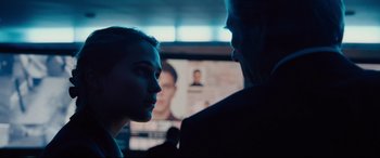 Movie still from “Jason Bourne” (2016), directed by Paul Greengrass – A man and a woman face to face in front of a television; Close Up shot, Over the shoulder angle
