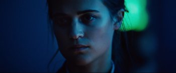 Movie still from “Jason Bourne” (2016), directed by Paul Greengrass – A woman's face in the dark; Close Up shot, Low angle